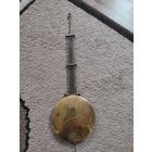 Маятник старых немецких часов.