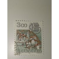 Марка Швейцария 1985 год нак зодиака Скорпион и пейзаж с деревней Кориппо.