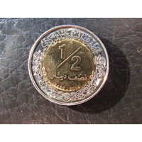 Ливия1\2 динара, 1435 (2014). С 20 копеек. Распродажа коллекции. Смотрите другие лоты.