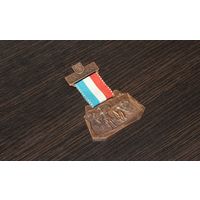 Металлическая медаль, памятная 10-го Международного народного забега Хаард, организованного спортивным клубом в 1983 г.