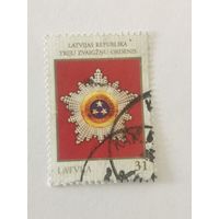 Марка из серии "Высшие государственные награды стран Балтии" - Орден Трёх Звёзд