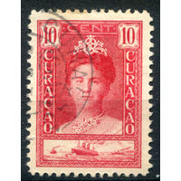 Нидерландские колонии - Кюрасао - 1928/30г. - 30 лет правления королевы Вильгельмины, 10 с - 1 марка - гашёная, есть немного жёлтых пятен сверху [Mi 95]. #3-WB-85-A-1