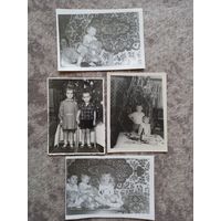 4 фота з дзецьмі і пляшкай партвэйна на стале.
